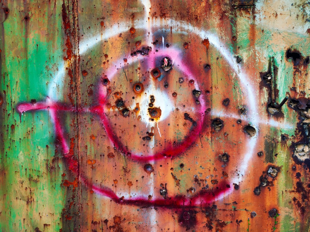 Painted bullseye with bullet holes