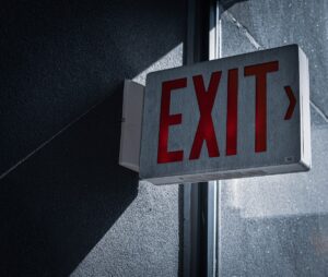 Exit Sign Representing a Person Visiting and Leaving a Business
