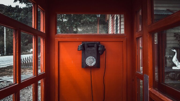 Phone in a phone booth representing how to build a better contact page on websites